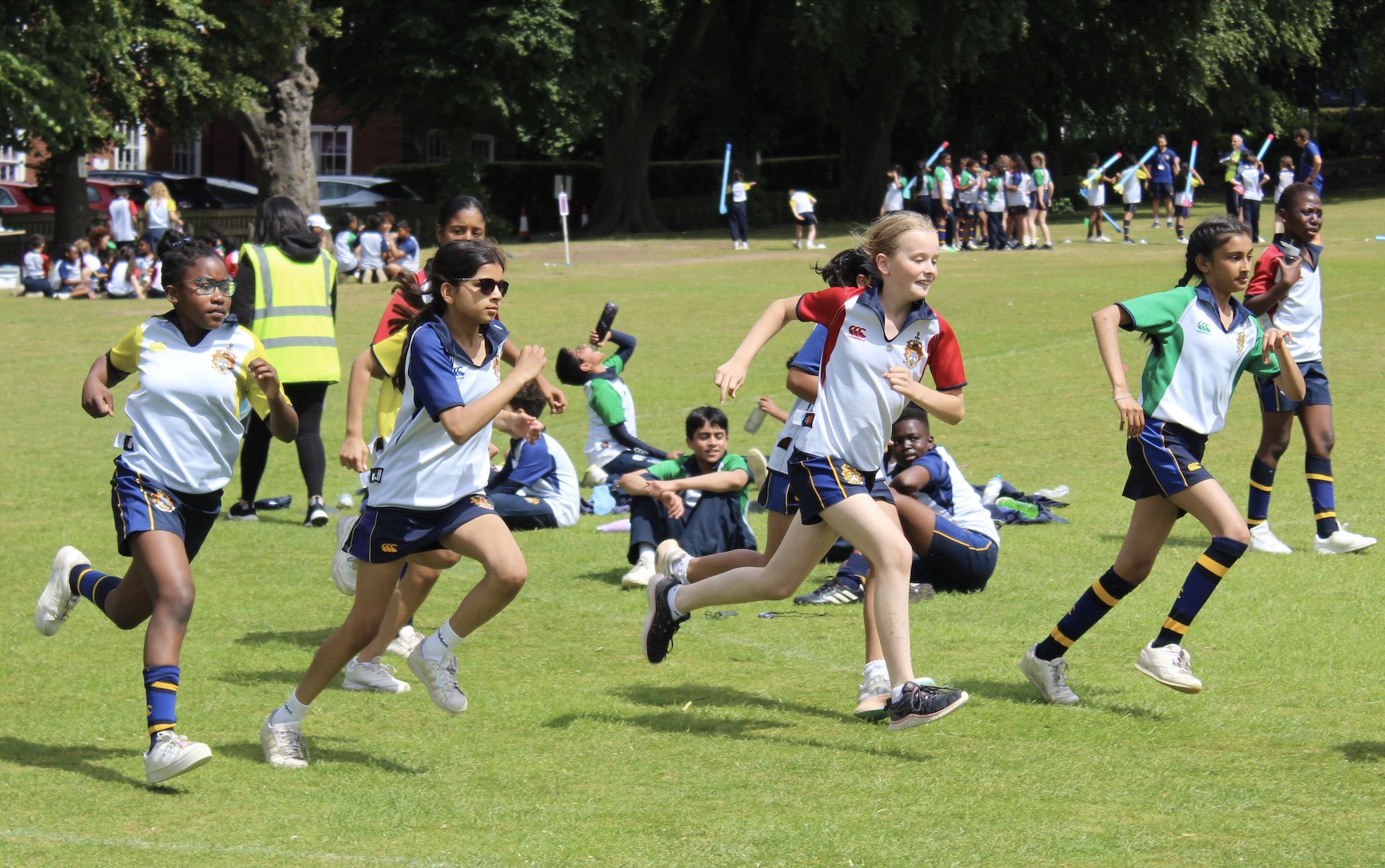 photo of pupils taking part in a running event at sports day
